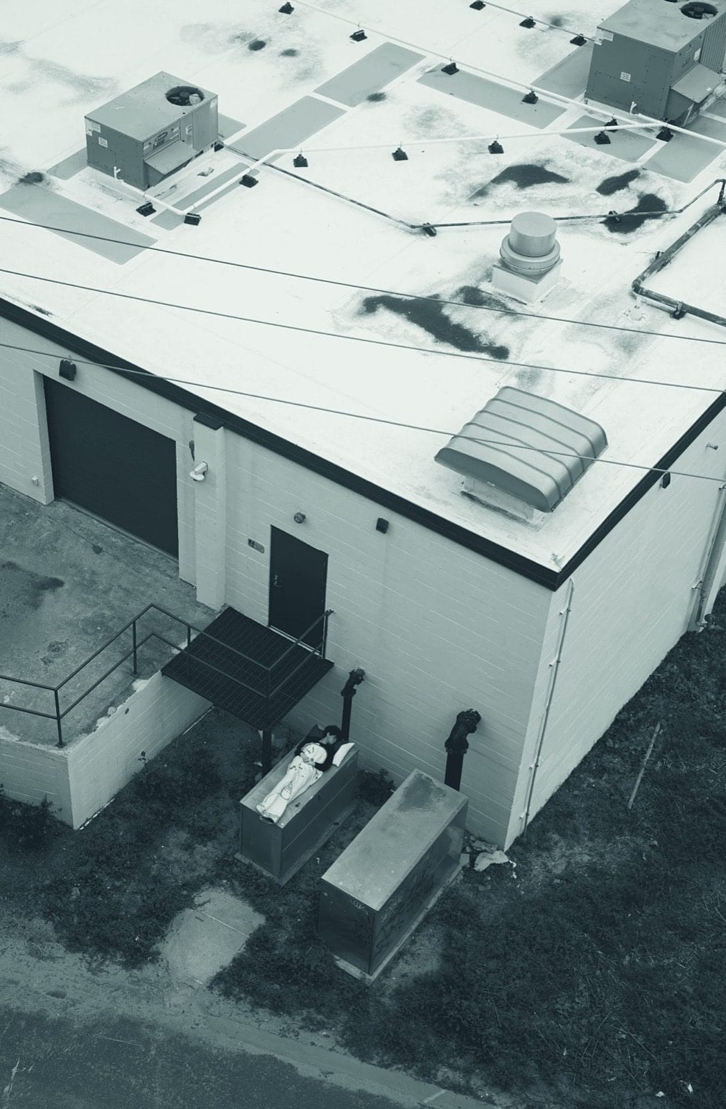 Clean white commercial roof viewed from a drone