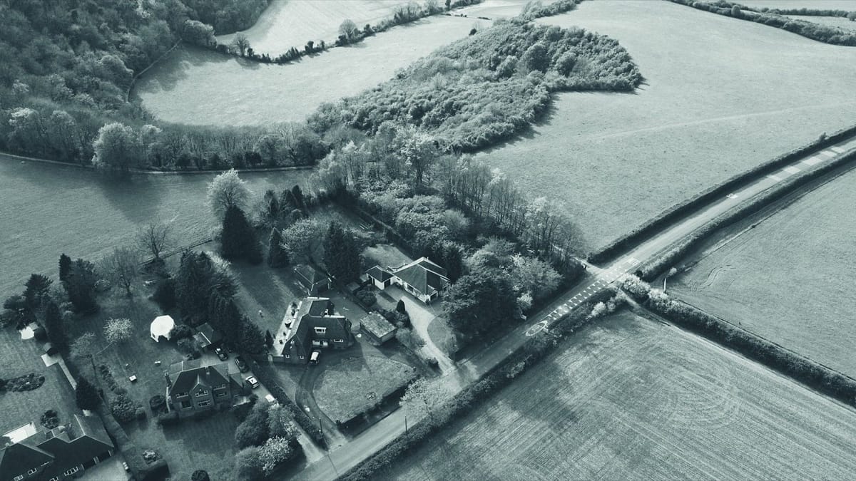 Aerial view of English countryside fields and houses