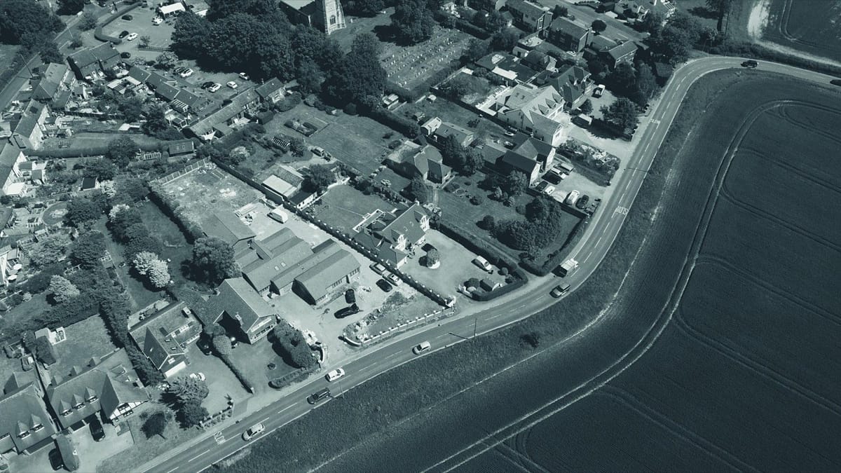 Aerial view of an English village and surrounding fields