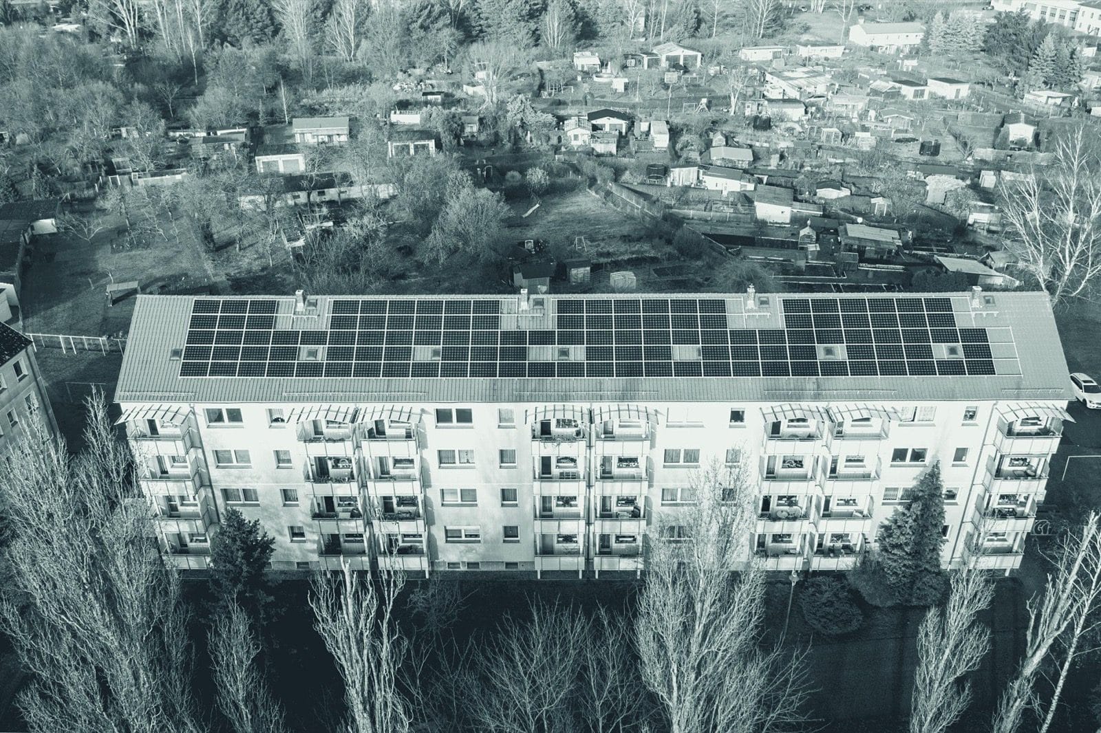 Aerial view of rows of rooftop solar panels