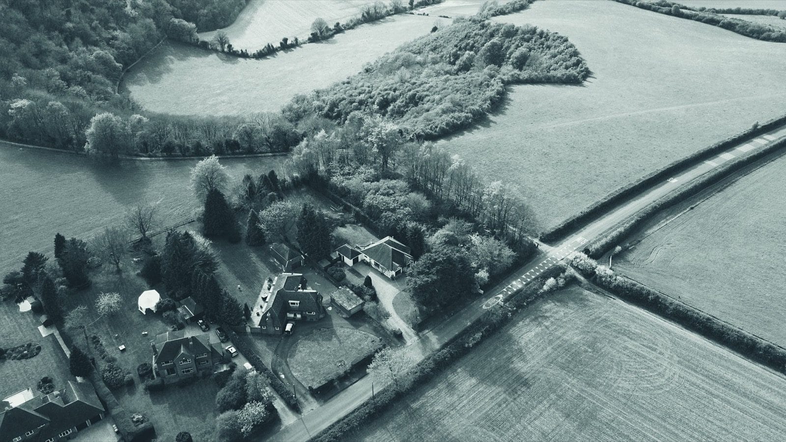 Aerial view of English countryside fields and houses