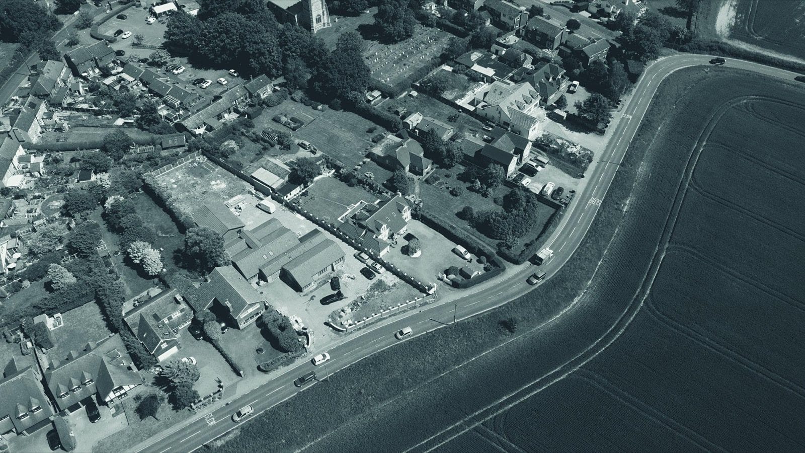 Aerial view of an English village and surrounding fields