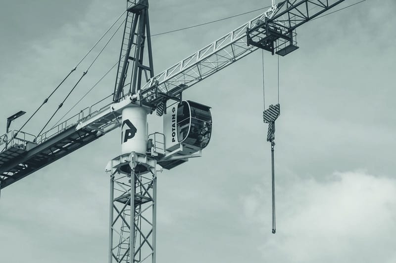 A construction tower crane against the sky