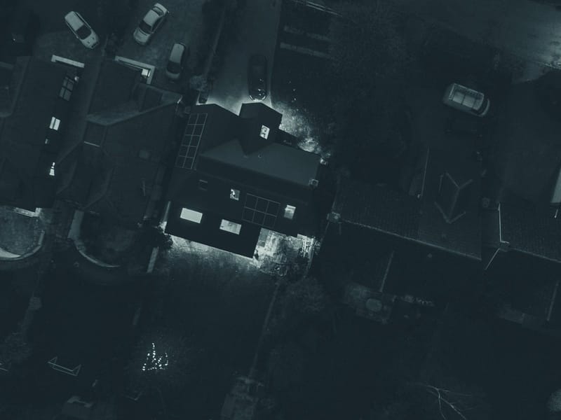 Aerial view of UK houses from above in the evening