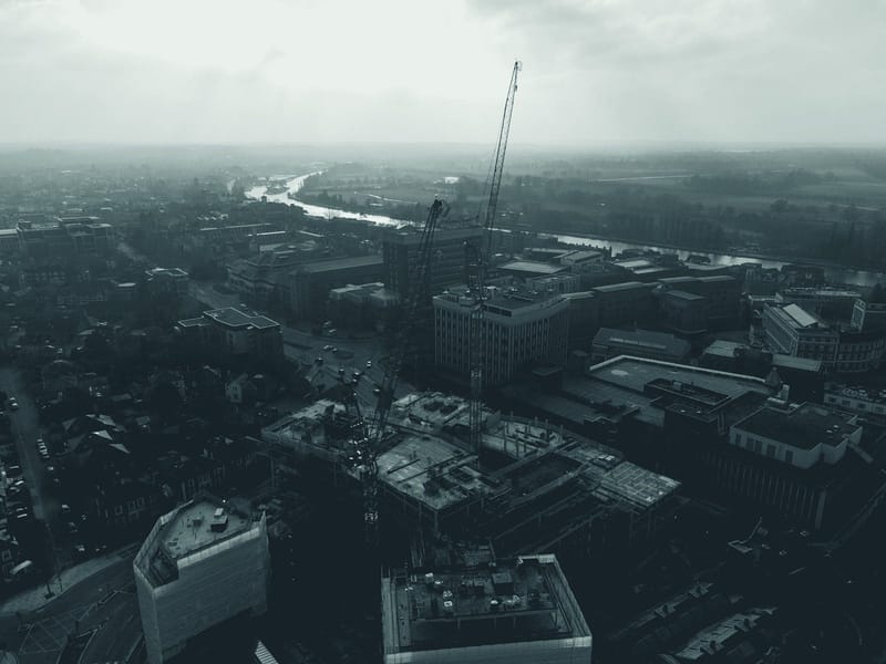 Aerial view of a construction site with cranes in Kingston upon Thames