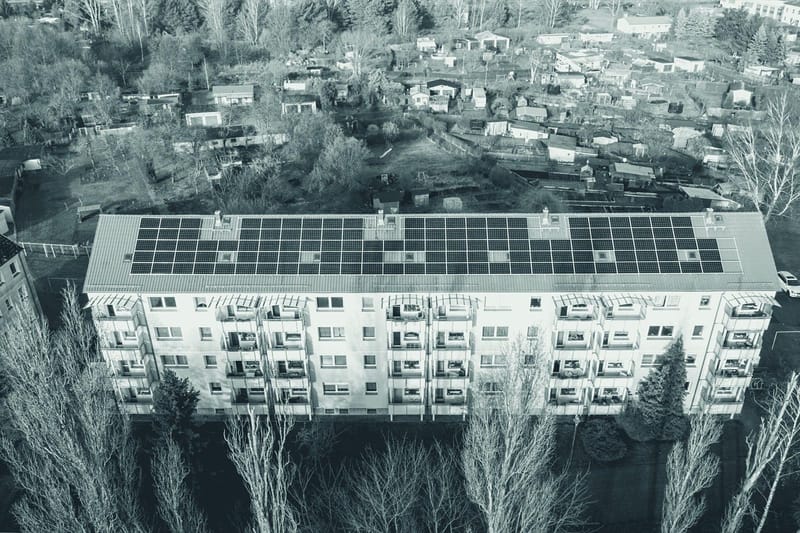 Aerial view of rows of rooftop solar panels