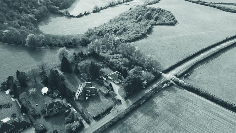 Aerial view of English countryside fields and houses